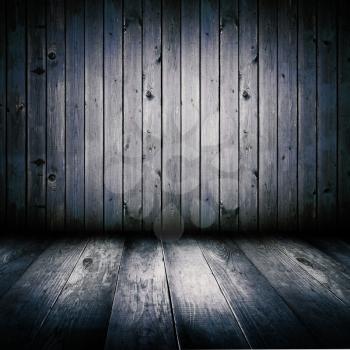 Interior of an old wooden shed, illuminated by the full moon.