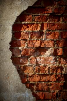 Old grunge brick wall with space for text. Vertical orientation.