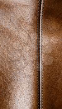 Seam on the brown leather (vertical orientation)