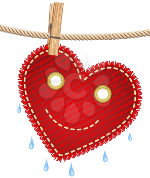 Textile red heart drying on a clothesline