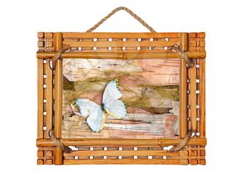 bamboo photo frame with abstract composition of butterflies, birch bark and straw isolated on white background