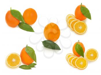 set of fresh ripe orange fruits with cut and green leaves isolated on white background