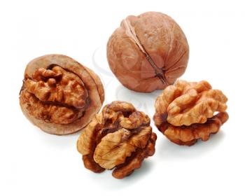 walnut and a cracked walnut isolated on the white background
