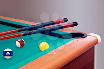 Green billiard table with balls and cues
