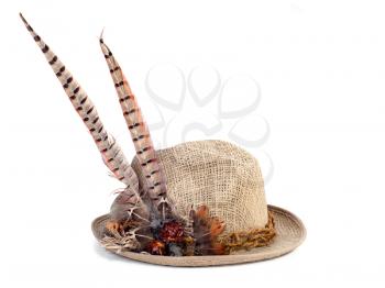 a hunting hat with pheasant feathers isolated on white
