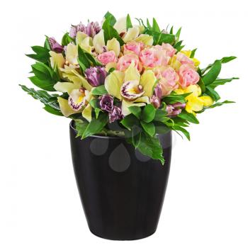 Floral bouquet of roses, lilies and orchids arrangement centerpiece in black vase isolated on white background. Closeup.