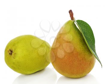 Pears with green leaves isolated on white background. Closeup.