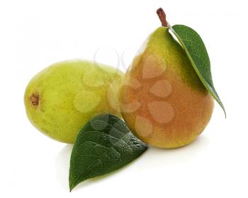Pears with green leaves isolated on white background. Closeup.