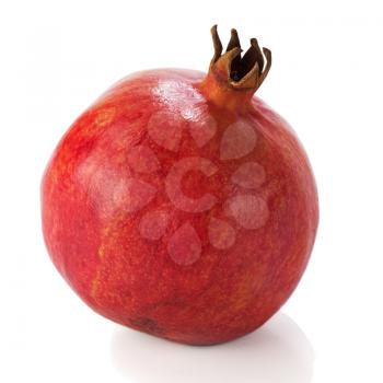 Ripe pomegranate fruit isolated on white background. Closeup.