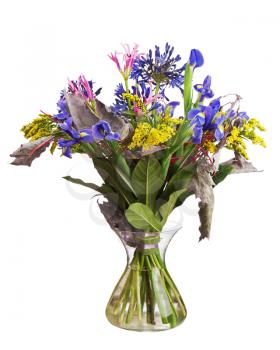 Bouquet from lilies and orchids in glass vase isolated on white background. Closeup.