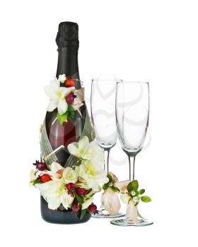 Champagne Bottle and Glass with Wedding Decoration of Flower Arrangements Isolated on White Background.