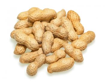 Pile of dry roasted peanuts isolated on white background. Closeup.
