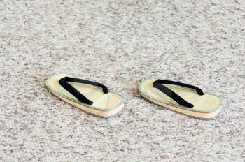 Pair of Traditional Japanese Sandals on Carpet Floor. Selective Focus.