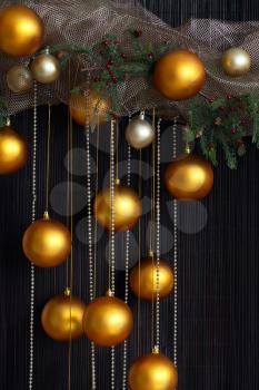 Christmas Balls and Spruce Branches with Cones on Natural Vertical Background.