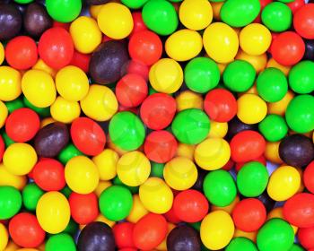 Multicolored candies for use as background. Closeup.