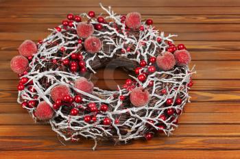 Christmas Wreath with Decorations on Wooden Background. Selective focus.