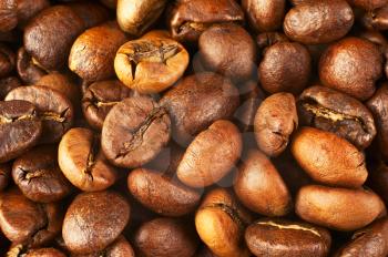 Natural background from roasted coffee beans. Macro shot with tilt effect.