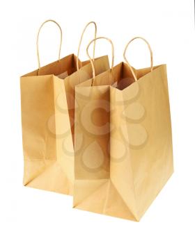 Empty brown recycled paper shopping bags isolated on white background. Side view from top.