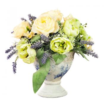 Bouquet from artificial flowers arrangement centerpiece in old vase isolated on white background.