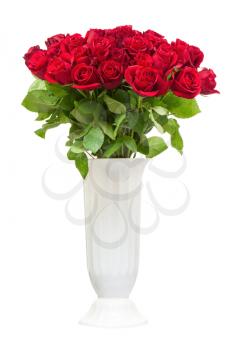 Colorful flower bouquet from red roses in white vase isolated on white background.