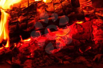 Fireplace burning. Warm burning and glowing fire in fireplace. Close up. Cozy background.