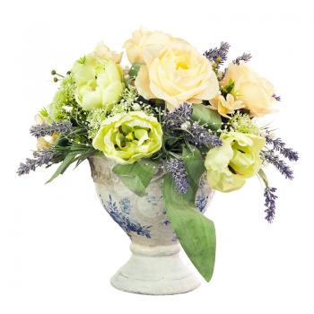 Bouquet from artificial flowers arrangement centerpiece in old vase isolated on white background.