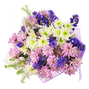 Beautiful bouquet of gerbera, carnations and other flowers in blue package isolated on white background.