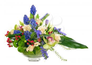 Bouquet from orchids and other flowers in glass vase isolated on white background. Closeup.