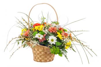 Flower bouquet from multi colored chrysanthemum and other flowers arrangement centerpiece in wicker basket isolated on white background.