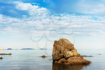 Beautiful seascape with rocks and cloudy sky. Japanese Sea. South of Primorsky Krai. Vladivostok. Russia.