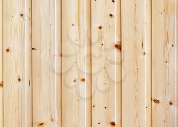 Wood pine planks lite brown texture fragment as a background composition.