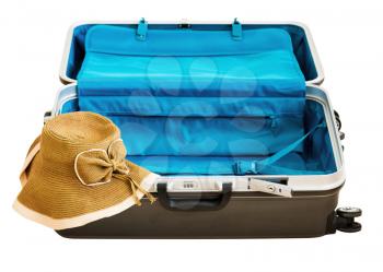 Large family polycarbonate luggage and summer sunny wicker hat isolated on white background. 
