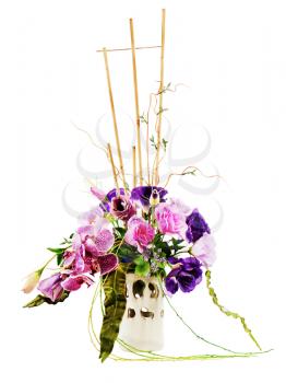 Colorful floral bouquet of roses, lilies and orchids arrangement centerpiece in vase isolated on white background. 