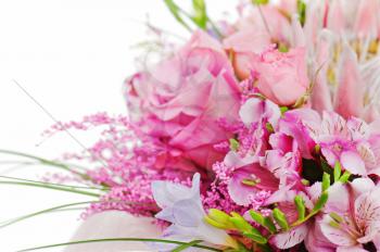 fragment of colorful bouquet of roses, cloves, orchids and freesia isolated on white background