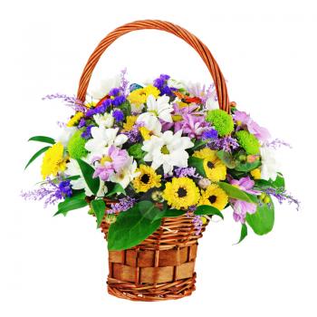 Flower bouquet in wicker basket isolated on white background. Closeup.
