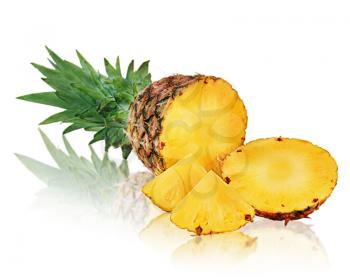 Ripe pineapple with slices isolated on white background. Closeup.