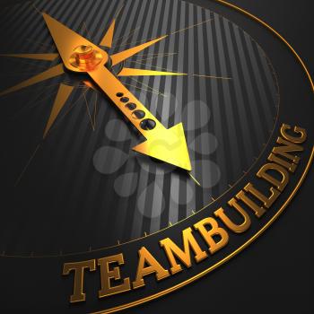 Teambuilding - Business Background. Golden Compass Needle on a Black Field Pointing to the Word Teambuilding. 3D Render.