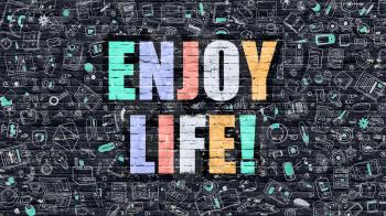Enjoy Life - Multicolor Concept on Dark Brick Wall Background with Doodle Icons Around. Modern Illustration with Elements of Doodle Style.Enjoy Life on Dark Wall.
