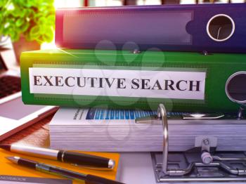 Executive Search - Green Office Folder on Background of Working Table with Stationery and Laptop. Executive Search Business Concept on Blurred Background. Executive Search Toned Image. 3D.
