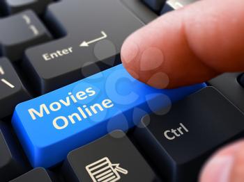 Movies Online Person Click on Blue Keyboard Button with Text Movies Online. Selective Focus. Closeup View. 3D Render.