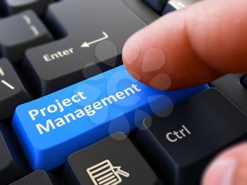 Project Management Button. Male Finger Clicks on Blue Button on Black Keyboard. Closeup View. Blurred Background. 3D Render.