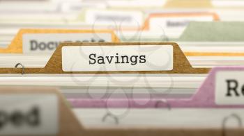 File Folder Labeled as Savings in Multicolor Archive. Closeup View. Blurred Image. 3D Render.