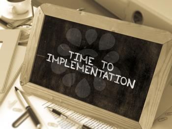 Time to Implementation Concept Hand Drawn on Chalkboard on Working Table Background. Blurred Background. Toned Image. 3D Render.