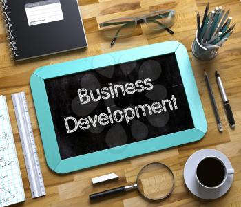 Business Development Handwritten on Small Chalkboard. Small Chalkboard with Business Development Concept. 3d Rendering.