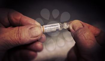 Injection of Antidepressant Ampoule in a Old Hands. Healthcare Pharmacy Treatment Concept. Close-up on Hand.