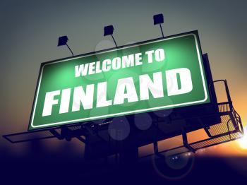 Welcome to Finland - Green Billboard on the Rising Sun Background.
