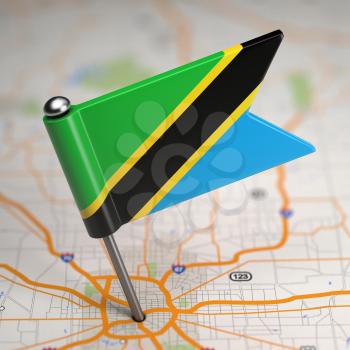 Small Flag of Tanzania on a Map Background with Selective Focus.