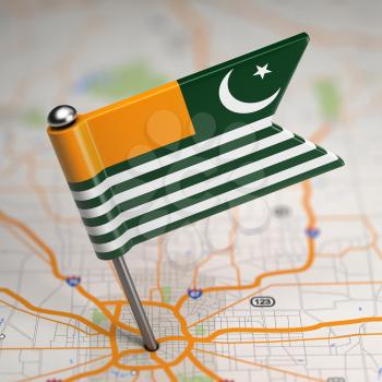 Small Flag of Azad Kashmir on a Map Background with Selective Focus.