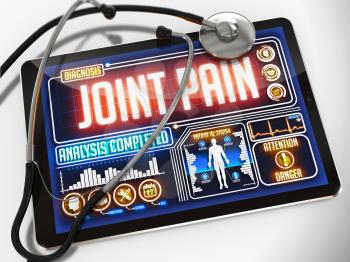 Medical Tablet with the Diagnosis of Joint Pain on the Display and a Black Stethoscope on White Background.