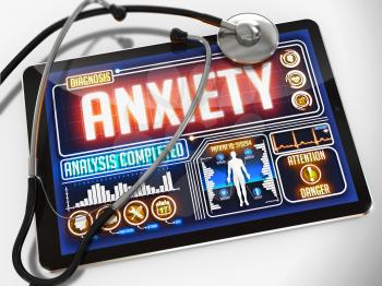 Anxiety - Diagnosis on the Display of Medical Tablet and a Black Stethoscope on White Background.